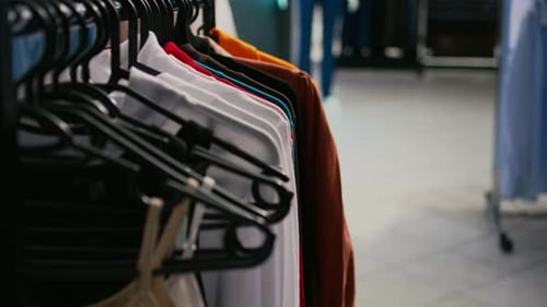 Multiple Formal or Casual Clothes Hanging in Clothing Store