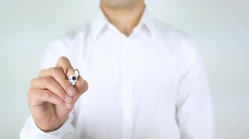 Adult Writing Local Marketing on Clear Surface