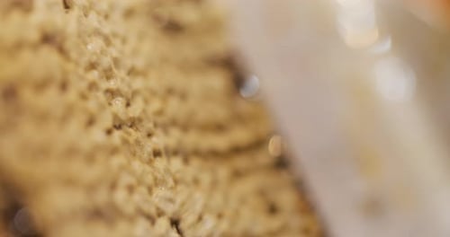 The Beekeeper Strips Wax and Produces Honey