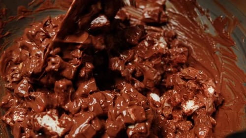 Chef Confectioner Making Chocolate with Nuts Dry Fruits Closeup Cooking Desserts Bakery and Candy