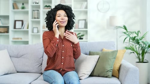 Woman Chatting on Cellphone in Bright Home