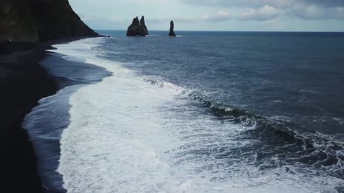 Black Sand Beach with Reynisdrangar Rocks in Iceland