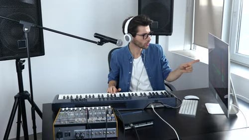 Young Man in Sound Recording Studio