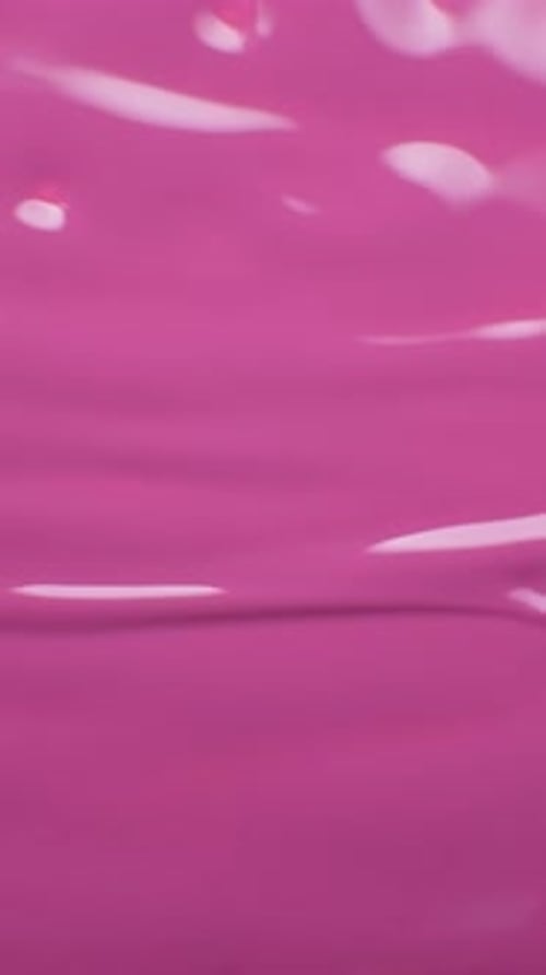Applying Bright Pink Nail Polish Close Up