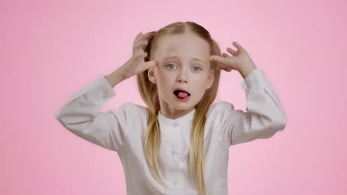 Girl Posing and Making Funny Faces in Studio