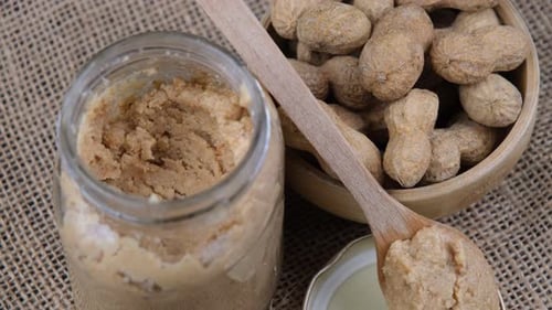 Peanut Butter Jar and Bowl of Peanuts