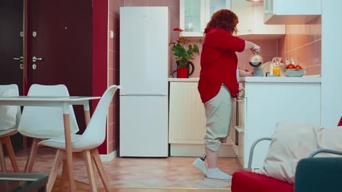 Woman with Prosthetic Leg Makes Coffee at Home