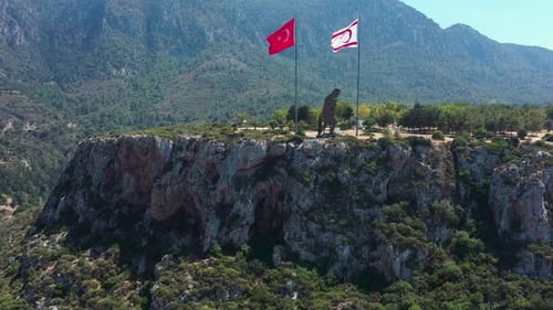 Flags Flying Above Cyprus Mountain Landscape, Aerial View
