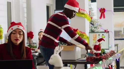 Employee Clears Desk Leaves for Holiday
