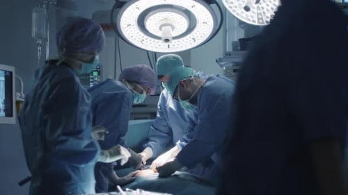 Medical Team Performing Surgical Operation in Modern Operating Room