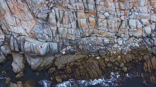 Aerial View of the Pacific Ocean Waves Hitting the Cliff Rocks