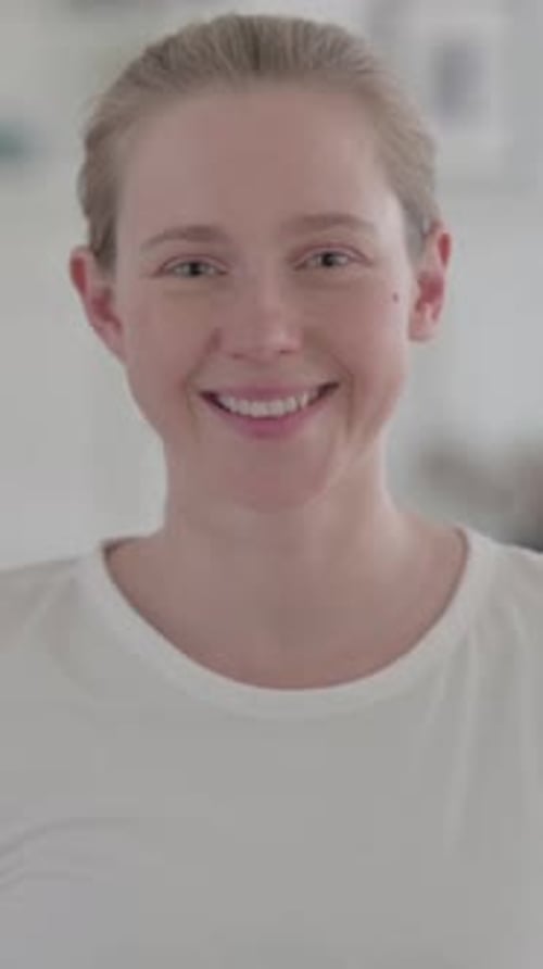 Portrait of Beautiful Young Woman Smiling at Camera at Home, Vertical Video