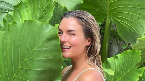 Woman Posing in Front of Tropical Leaves Concepts of Beauty Spa