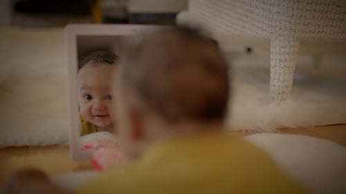 Baby Discovers Reflection in Mirror at Home