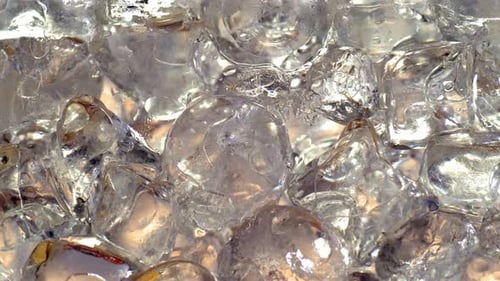 Glass full of ice cubes gradually being filled with cider 4K. Cider, beer, prosecco, pink wine, appl
