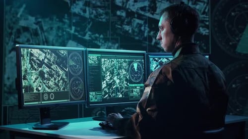 Military Soldier Operating Advanced Technology in a Command Center