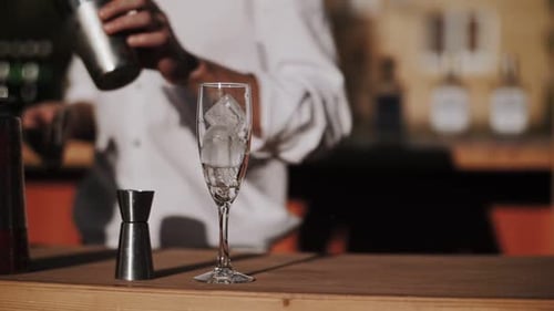 Bartender Prepares a Cocktail in an Outdoor Bar