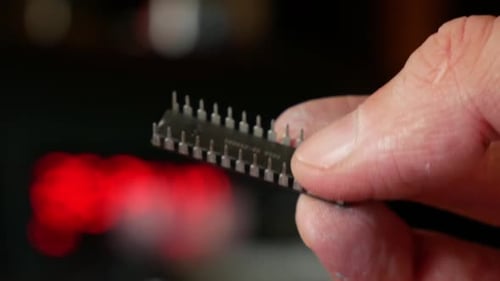 Close-up of a computer chip in hands