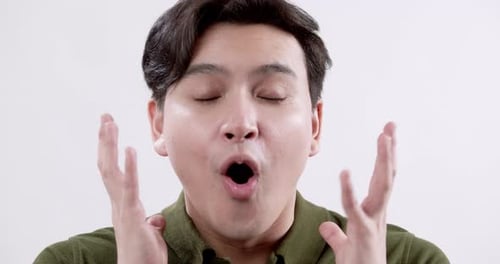 Young Man Reacts with Surprise, Shock, and Astonishment