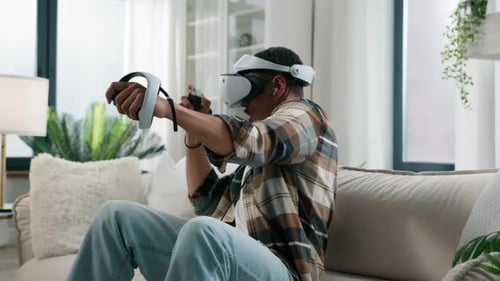 Man Wearing VR Headset Playing Video Game