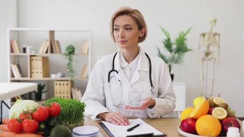Woman Doctor Holding a Glass of Water