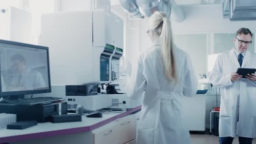 Scientists Conducting Research in Modern Lab
