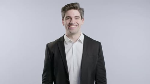 Smiling Man in Suit Looking at Camera