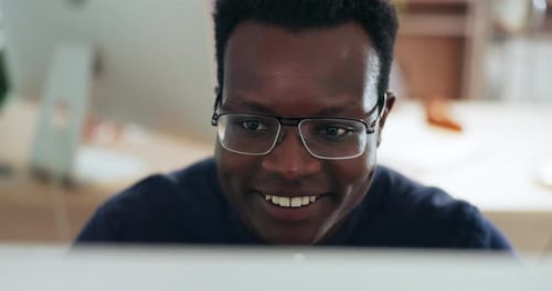 Man, computer and smile for reading online article or happiness, satisfied research