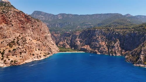 Stunning blue waterscape of the Mediterranean Sea surrounded by the rocks. Turkey nature.