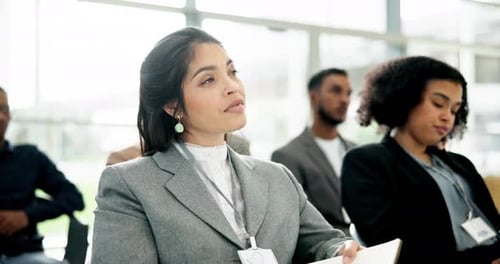 Corporate Conference Attendees Listen to Presentation