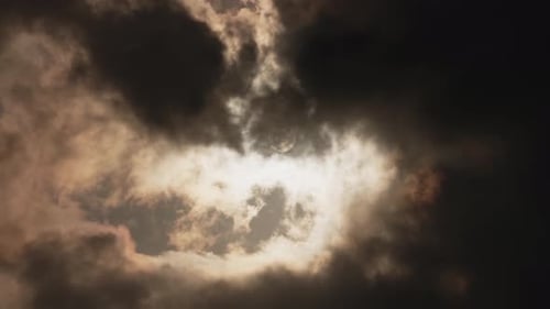 Sunlight Streaming Through Dark Dramatic Clouds