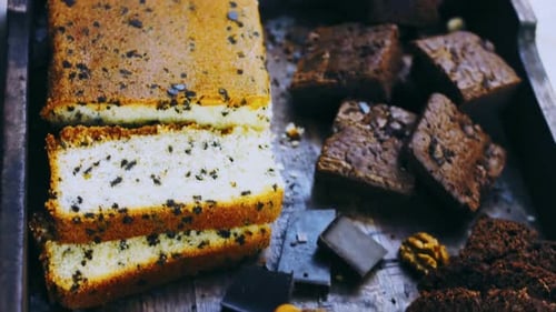 Different Kinds of Cakes Arranged on a Wooden Tray