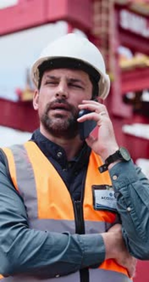 Construction, man or talk on site with phone call for building instructions