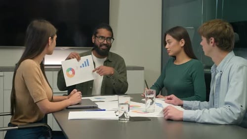 Team Discussing Data at Business Meeting