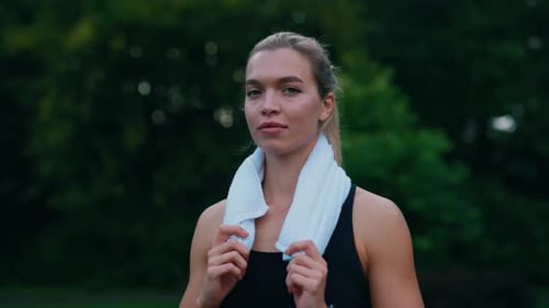 Portrait of the Female Runner Standing Lin the Park Before Running