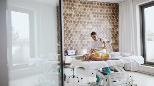 Senior Woman Foot Massage Therapy at Resort