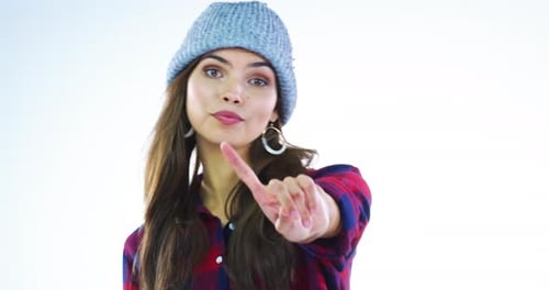Woman Wearing Beanie Making Hand Gestures