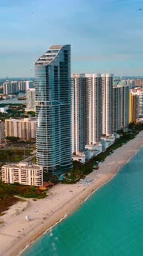 Stunning view of Miami Beach at sunset. Aerial perspective of the city from footage above