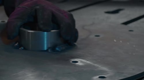 Close-up of welder holding metal welding