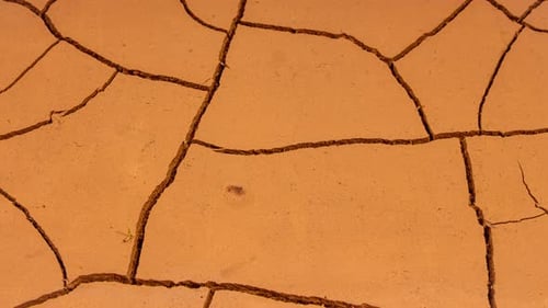 Cracked Soil in a Desert Drying Out in Timelapse. Ground Draining, Cracked Earth, Global Warming