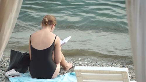 Woman Reading Book and Sitting on the Beach on Vacation Summer Holidays Travel Concept Summer Chill