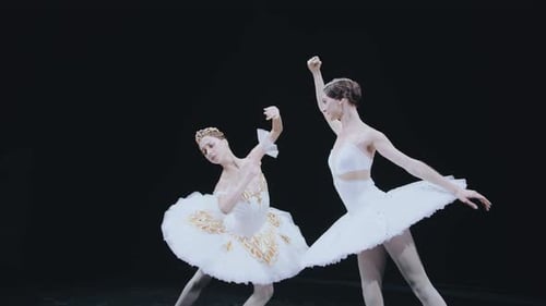 Two Ballet Dancers in White Tutus Performing