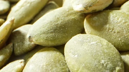 An up-close and detailed view of pumpkin seeds.