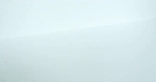 Hands Placing a Christmas Gift on White Background