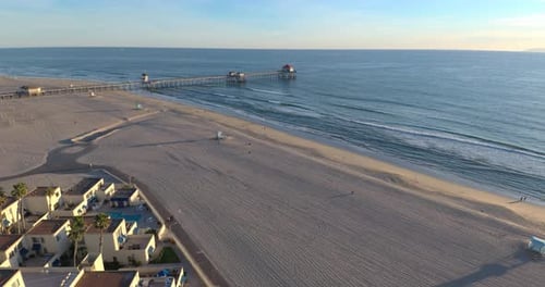 A flyover of a 4K aerial view past beach front condos. A perfect travel destination.