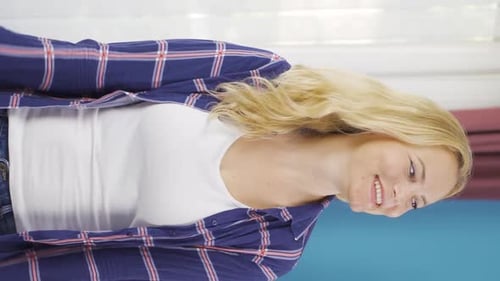 Smiling Woman with Blond Hair Looks at Camera