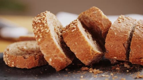 Sliced Brown Bread on Black Cutting Board