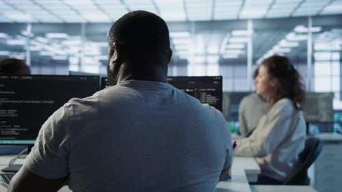 Admin Working in Computer Network Security Data Center Listening Music