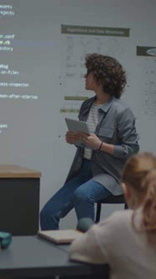 Teacher Explains Algorithms to Students in Classroom