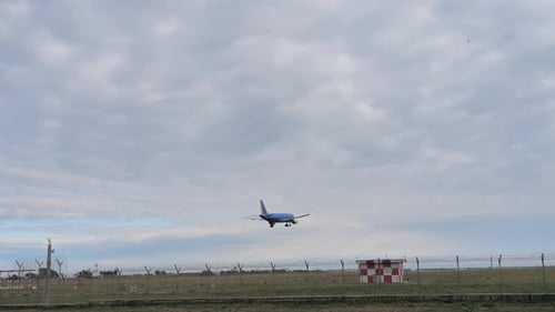 Airplane Appoaching for Landing in Overcast Sky